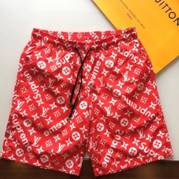 LV&Supreme 18ss沙灘褲 進口數碼印花 內裡採用網布拼接 舒適透氣強 上身之後毫無負擔感 潮流時尚夏季男士必備花短款 顏色黑 藍 紅 碼數30--38